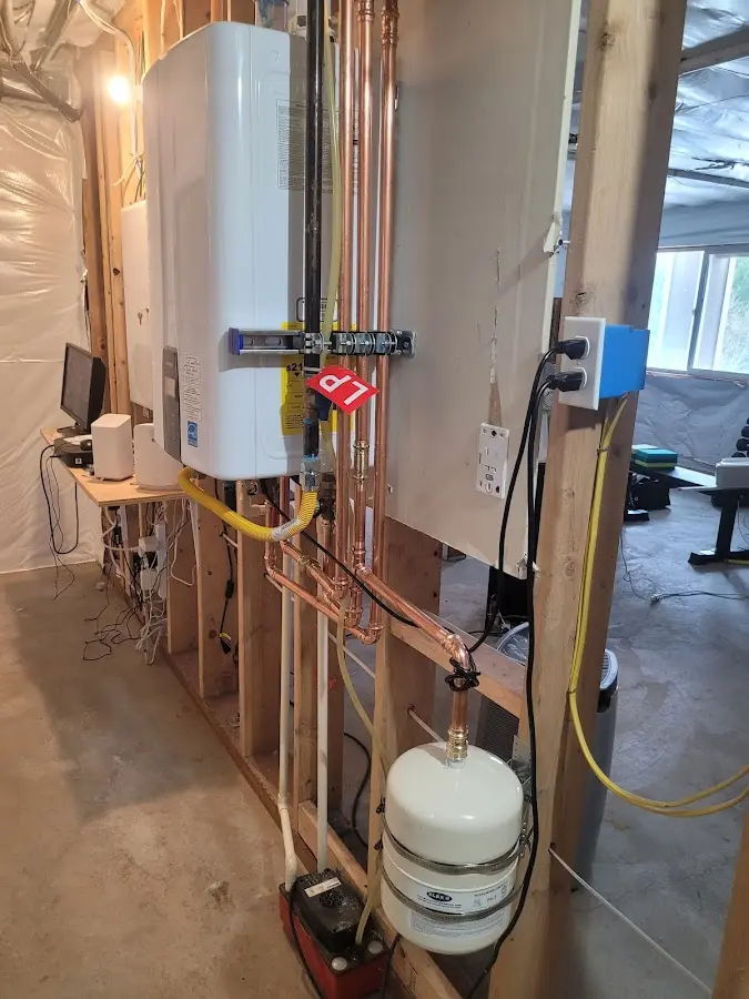 Licensed plumber repairing a kitchen sink in Girard